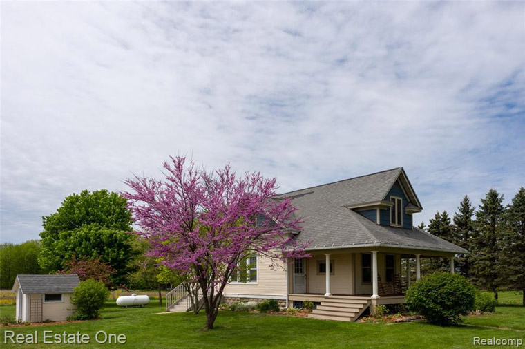 House with beautiful shrubbery and a flowering tree in front located at 1455 N SEARLS Road